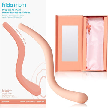 Image shows the perineal massage wand in front of its box on the left side and on the right side the open box showing the mirror inside and the cloth storage bag