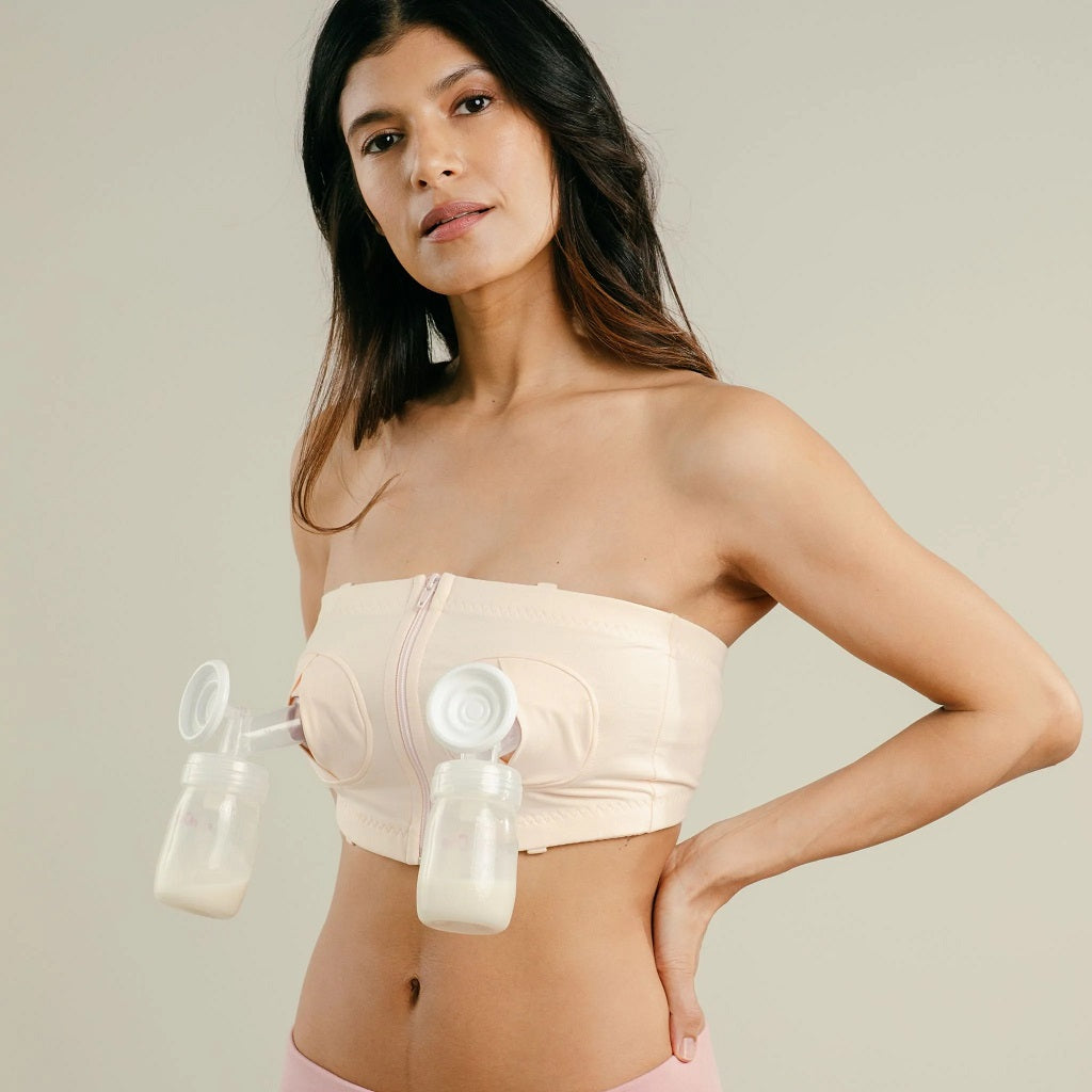 http://www.naturalresources-sf.com/cdn/shop/products/1024x1024-simple-wishes-hands-free-pumping-bra-pink-with-bottles.jpg?v=1659122403