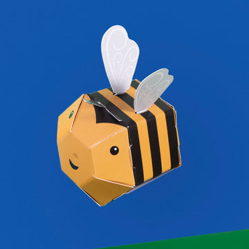 Image shows the assembled bee as if flying, against a blue background 