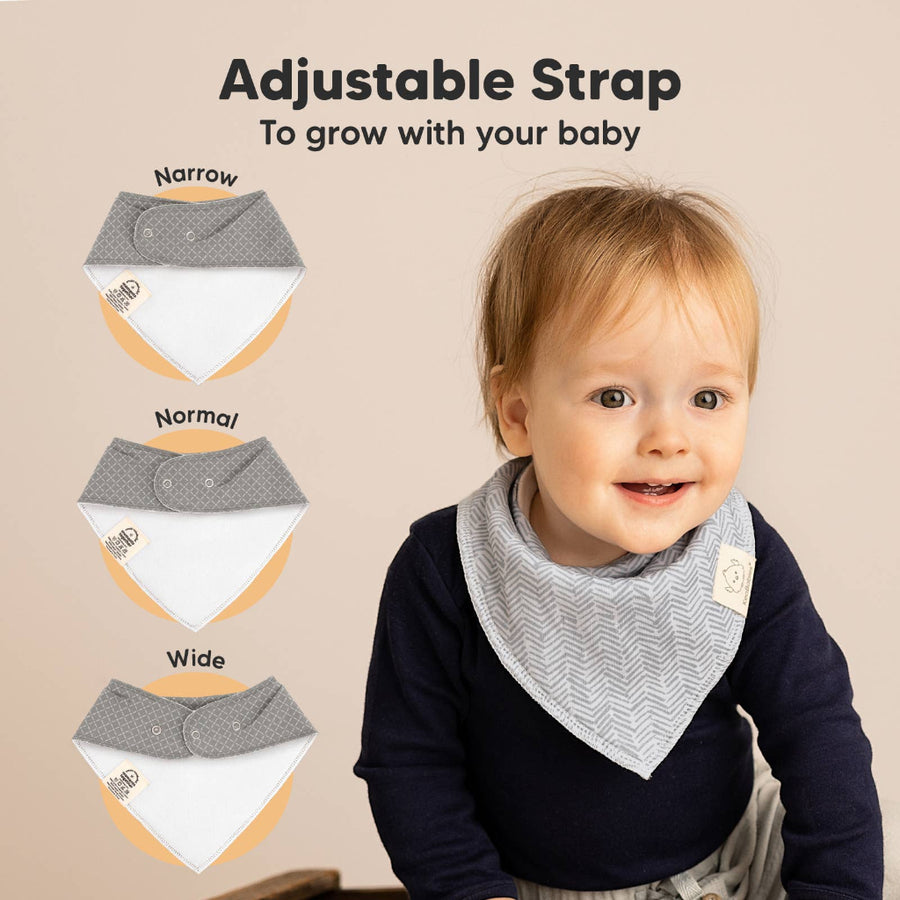 Baby wearing a bib with adjustable strap options displayed on a beige background