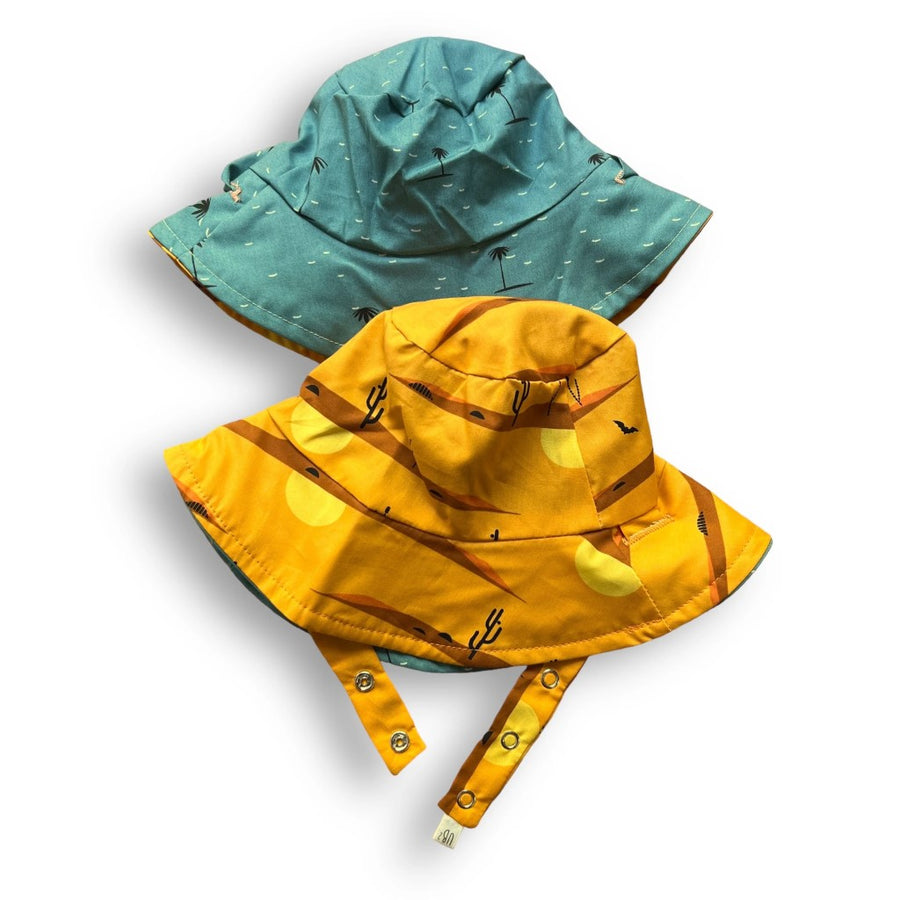 https://www.naturalresources-sf.com/cdn/shop/files/1024x1024-urban-baby-bonnets-organic-reversible-baby-bucket-sun-hat-desert-oasis_900x.jpg?v=1685121271