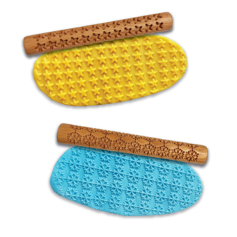 Two wooden rolling pins with star patterns on a yellow and blue playdough