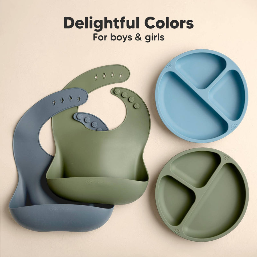 Children's silicone bib and plates in green and blue on a beige background with text 'Delightful Colors For boys & girls'.