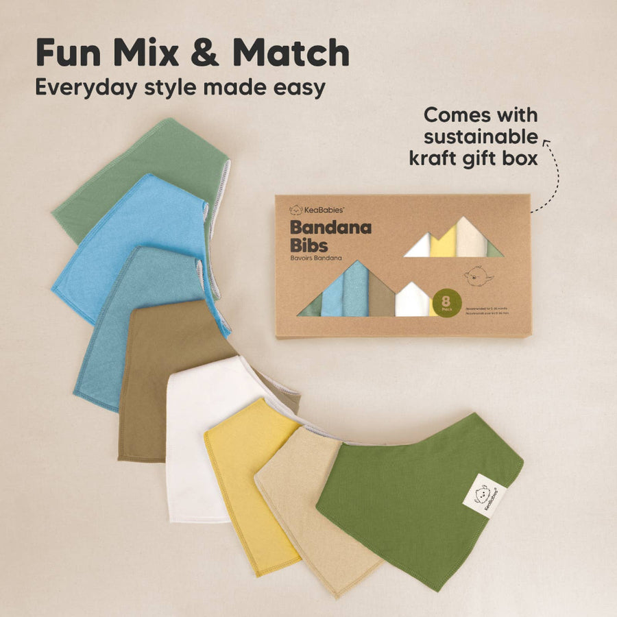 Set of bandana bibs in various colors with a packaging box on a beige background