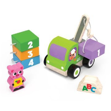 Set of colorful wooden toys including a truck, blocks, and a piggy bank on a white background