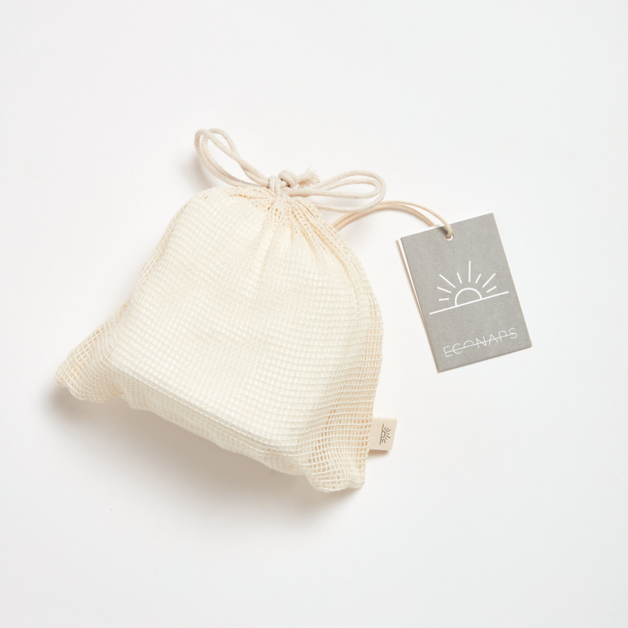 Fabric drawstring bag with a tag on a white background