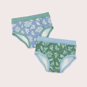 Two pairs of children's underwear with kelp patterns on a light pink background