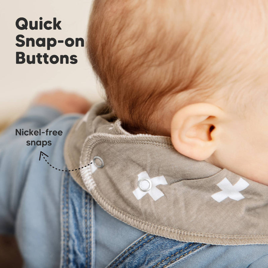 Baby wearing a bib with quick snap-on buttons and nickel-free snaps highlighted.
