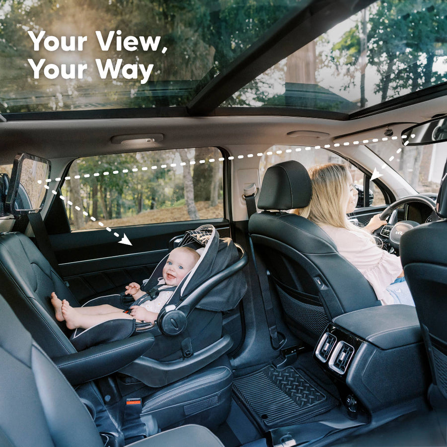 Car interior with a child in a car seat and a woman driving, with text 'Your View, Your Way'.