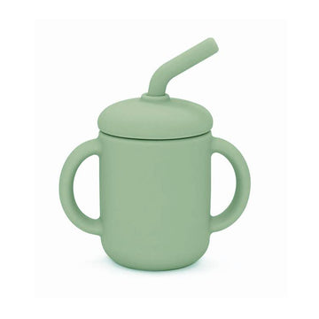 Green sippy cup with a straw on a white background