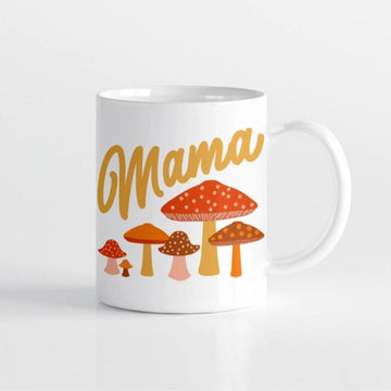 Picture of the mug against a white background. It has the word Mama in dark yellow cursive script, above a variety of toadstool type mushrooms in shades of red, yellow, orange, brown, and yellow