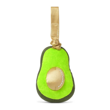 Avocado-shaped toy with a gold seed on a white background