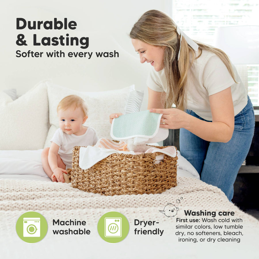 Woman and child with a laundry basket on a bed, emphasizing durability and softness with each wash.