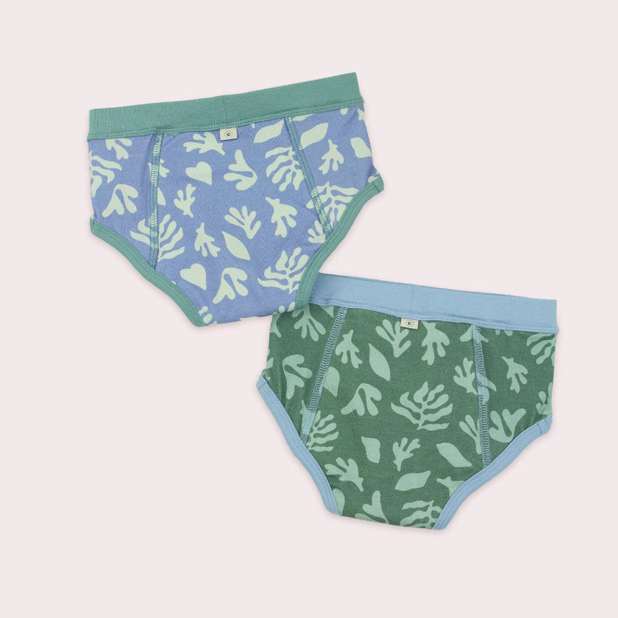Two pairs of underwear with kelp patterns on a light gray background
