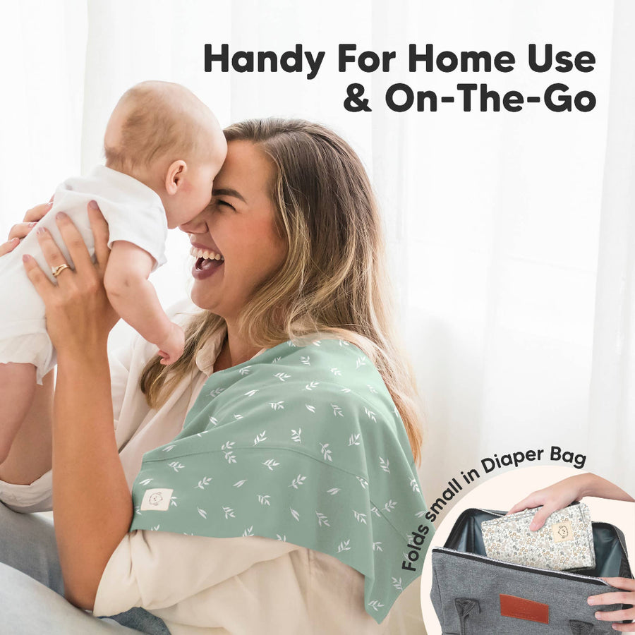 Woman holding a baby with a green burp cloth, with text 'Handy For Home Use & On-The-Go' and 'Folds small in diaper bag'.