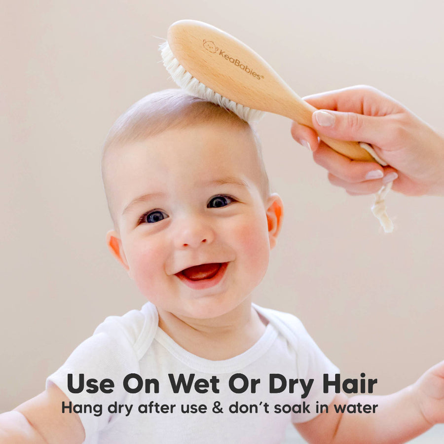 Baby being brushed with a wooden brush, with text on using the brush on wet or dry hair.