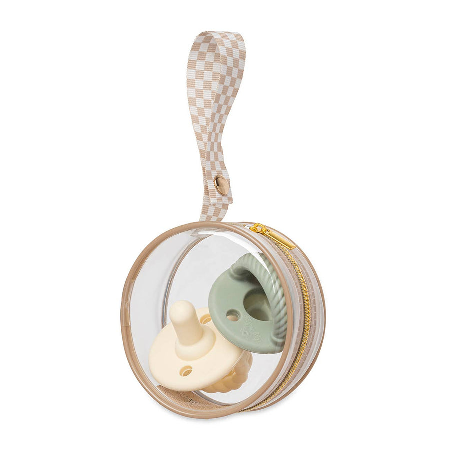 picture of the Itzy clear pacifier case with a pale pink and a sage green silicone pacifier inside, against a white background