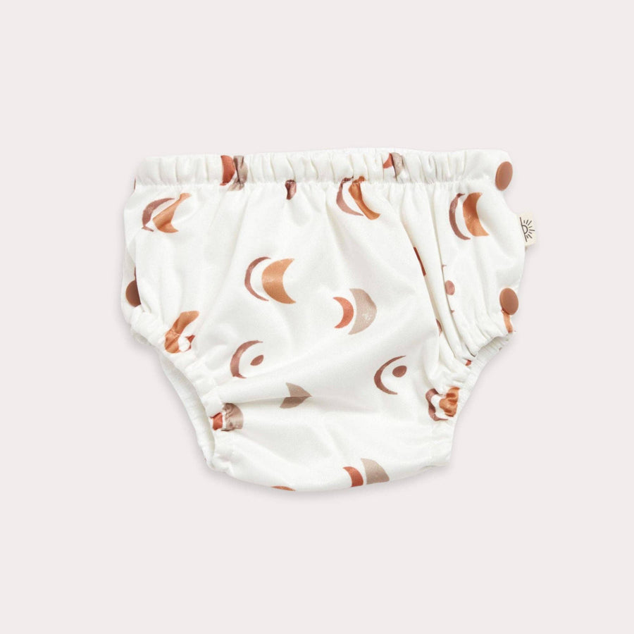 Baby swim diaper with moon pattern on a  white background