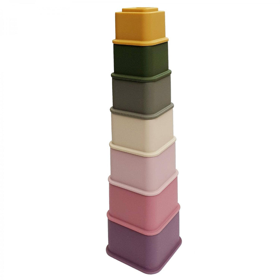 Stack of colorful square silicone cups on a white background
