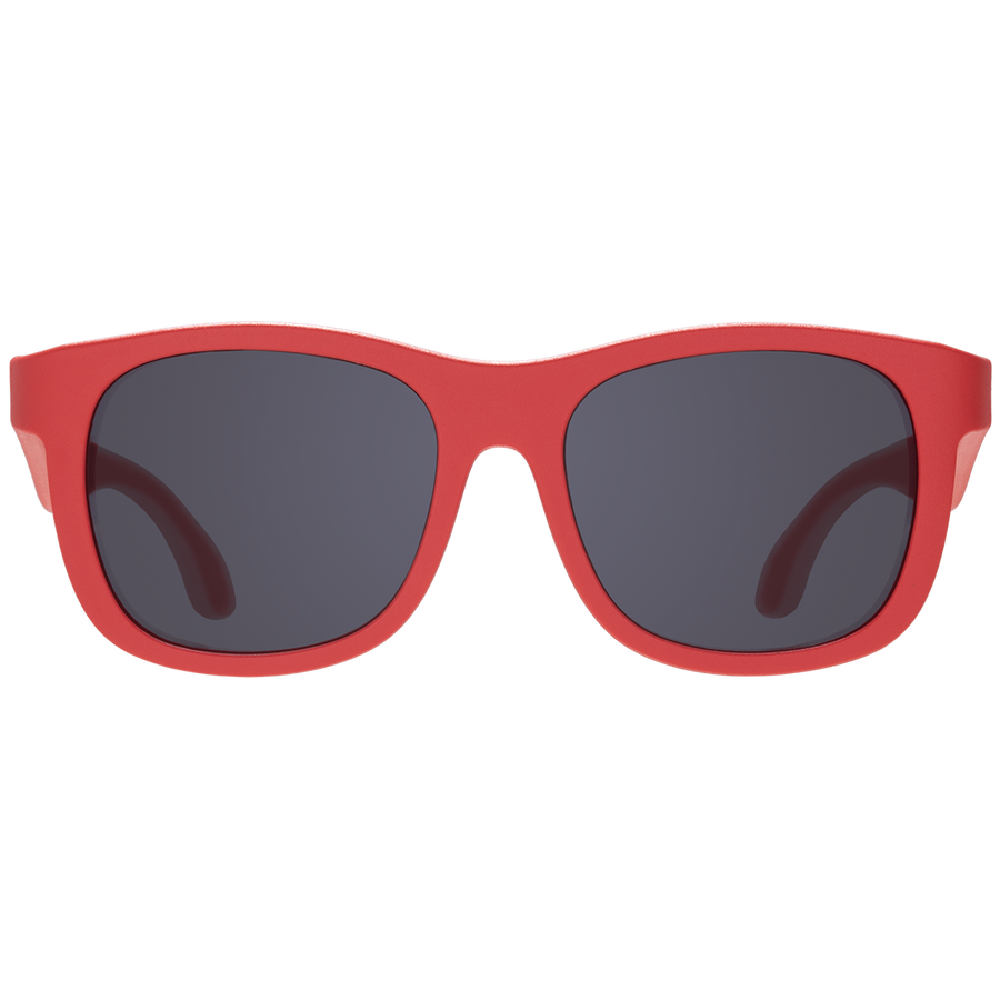 Red sunglasses with dark lenses on a white background