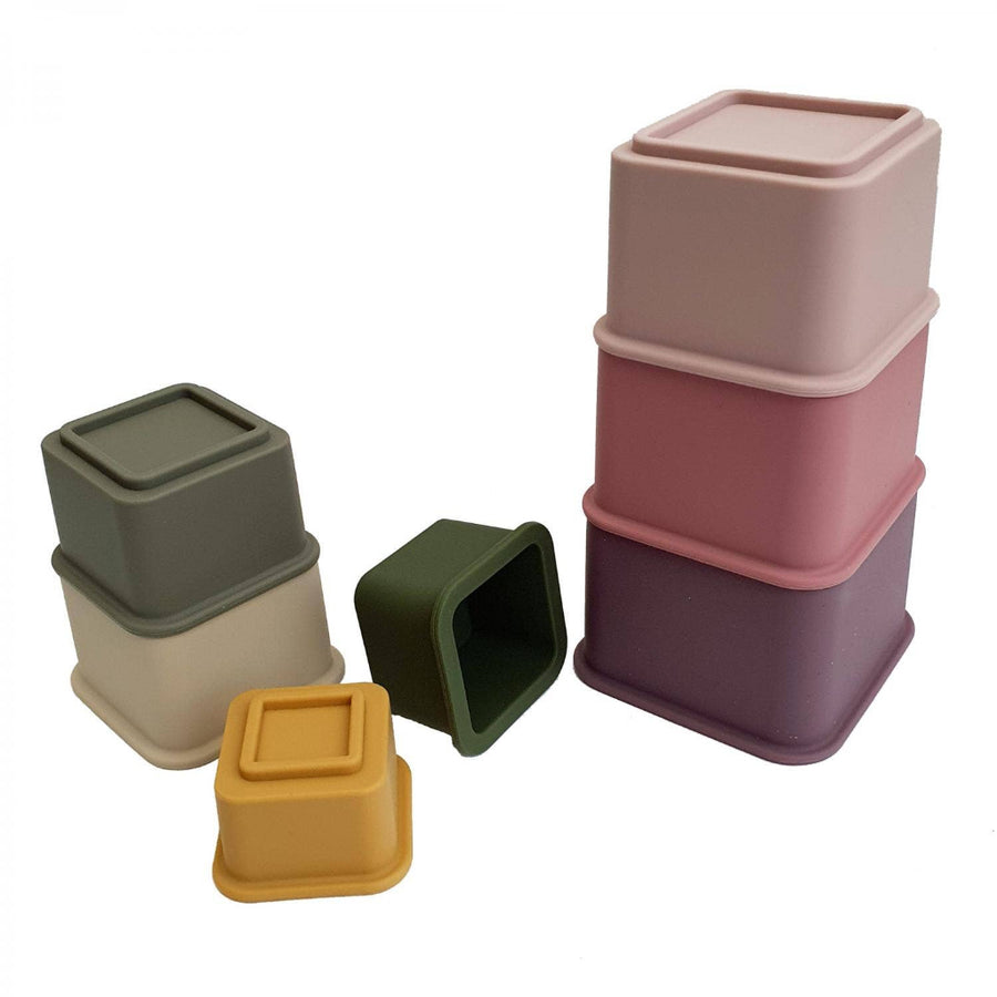 Set of colorful square silicone cups on a white background