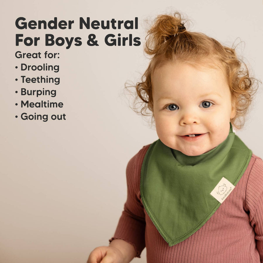 Child wearing a green bib with text about its uses on a beige background