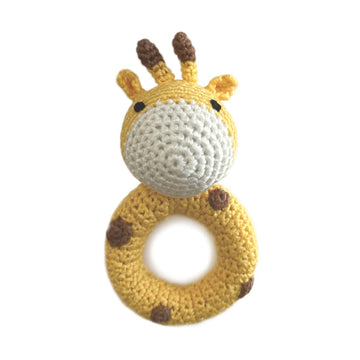 Crocheted giraffe rattle toy on a white background