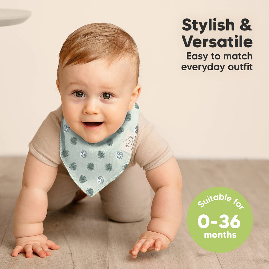Baby crawling on a carpet wearing a patterned bib with text about its style, versatility, and suitability for ages 0-36 months.