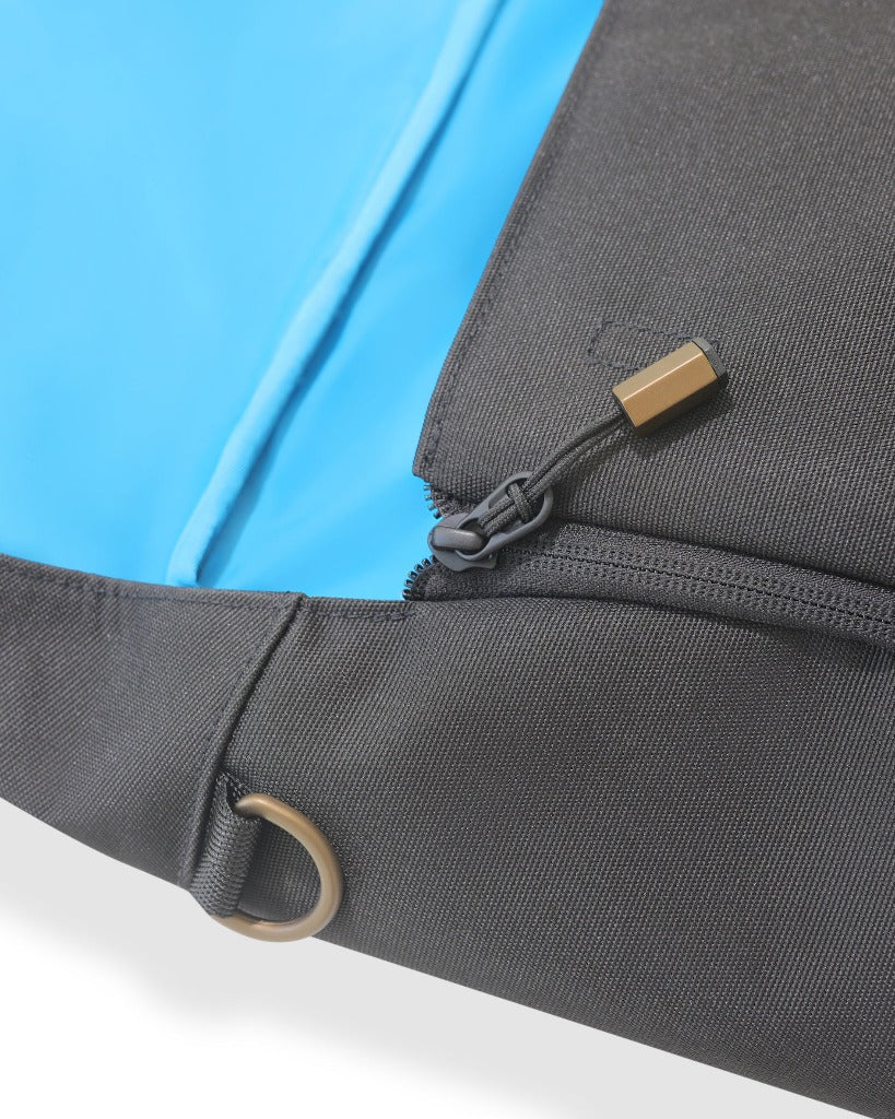 Picture of the backpack showing a closeup of the zipper pull and D loop hardware