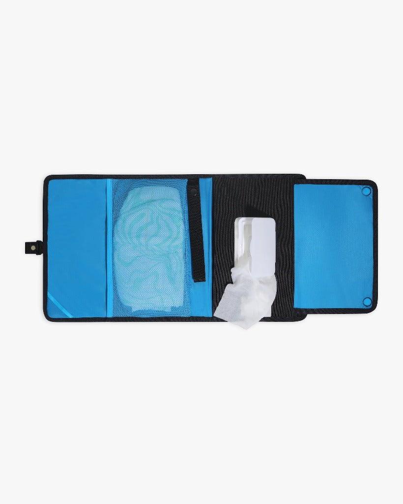Picture of the unfolded black changing wallet showing the interior pockets and wipes case