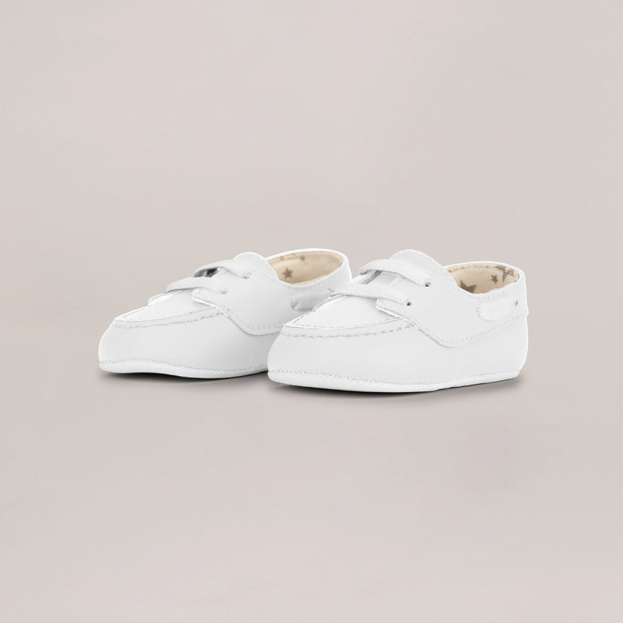 Pair of white sneakers on a light gray background