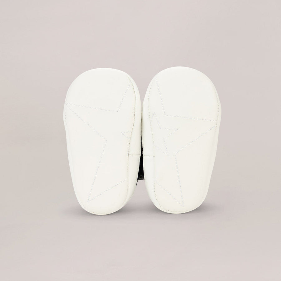 White soled shoe  on a light gray background