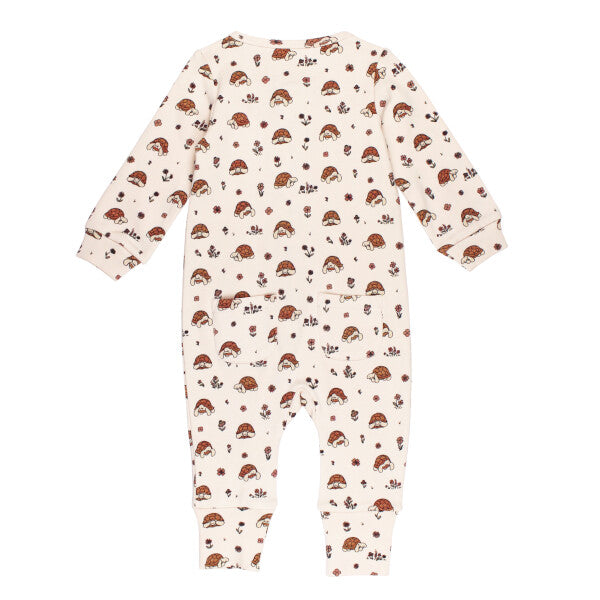 Baby romper with tortoise pattern on a white background