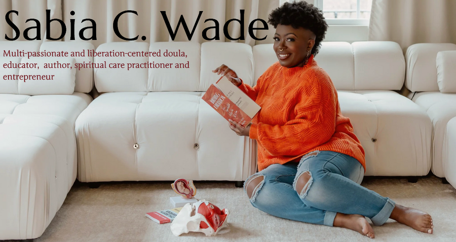Woman in orange sweater sitting on a white couch holding a box, with text about Sabia C. Wade.