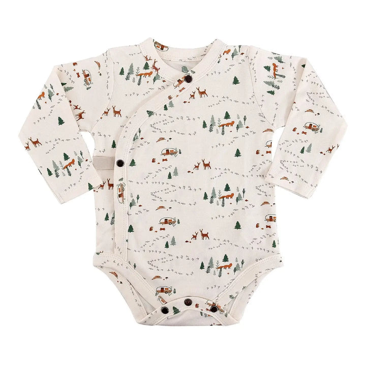 Baby onesie with forest pattern on a white background