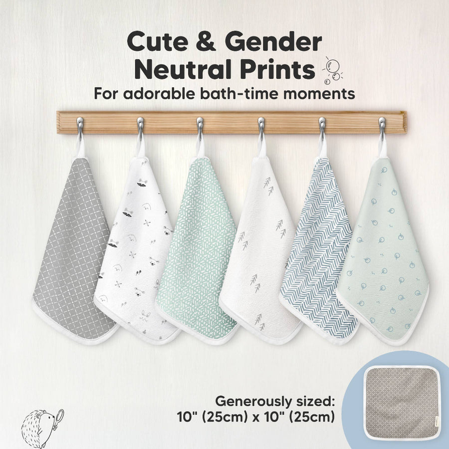 Set of gender-neutral baby washcloths hanging on a rack with text about cute prints and dimensions.