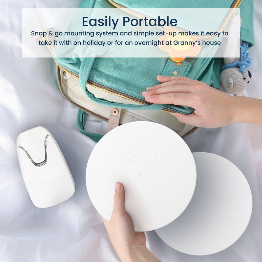 Image showing a person's hands placing the baby monitor parts into a bag. Text reads, 