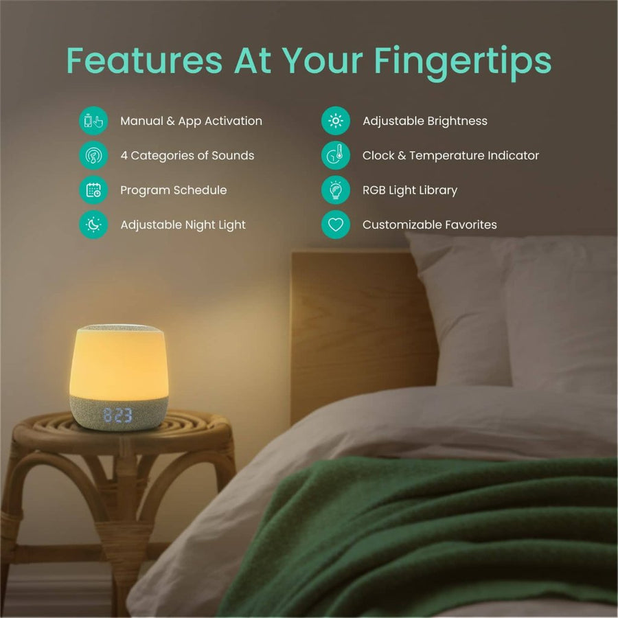 Picture of a nightlight sound machine clock on a bamboo side table next to a bed, with text that reads, 