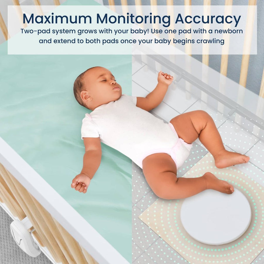 Picture of a baby lying on their back in a crib equipped with the pad monitor. Text reads, 