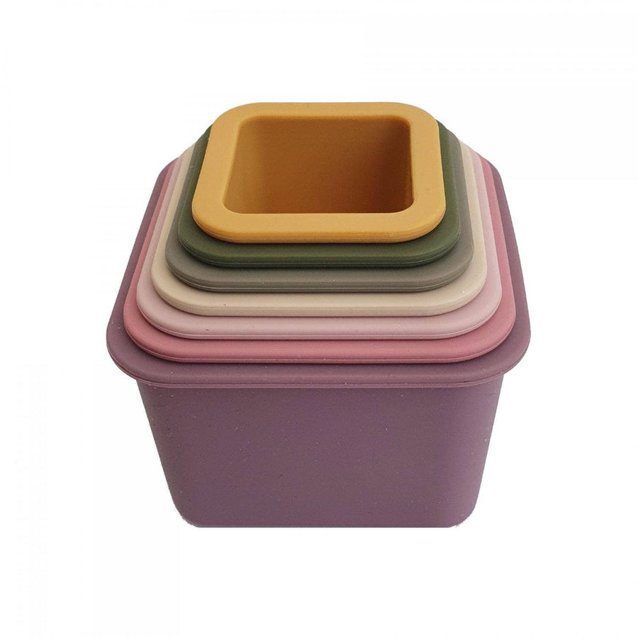 Stack of colorful square containers on a white background