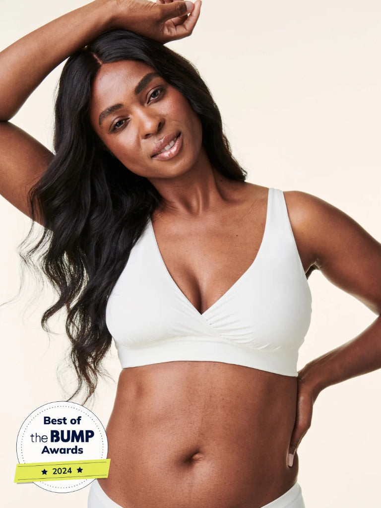 Woman wearing a white bra with 'Best of the BUMP Awards' badge on a beige background
