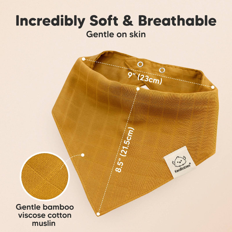 Brown bandana bib with measurements and text about softness and gentle on skin, on a beige background.