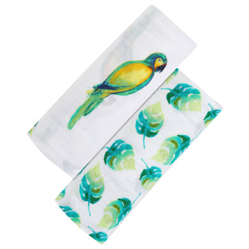 Two fabric swatches with tropical leaf and parrot designs on a white background