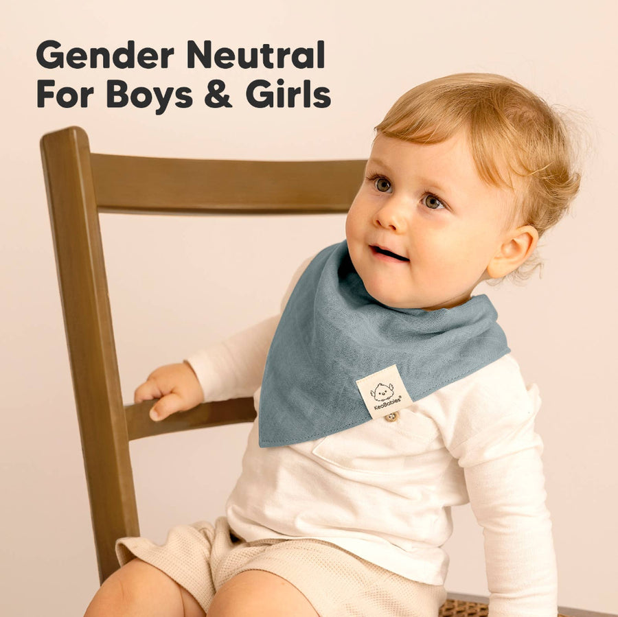 Child wearing a blue bib with a brand logo, sitting on a chair with text 'Gender Neutral For Boys & Girls'.