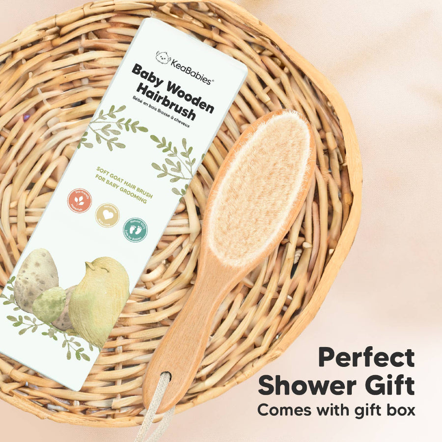Baby wooden hairbrush with packaging on a woven basket