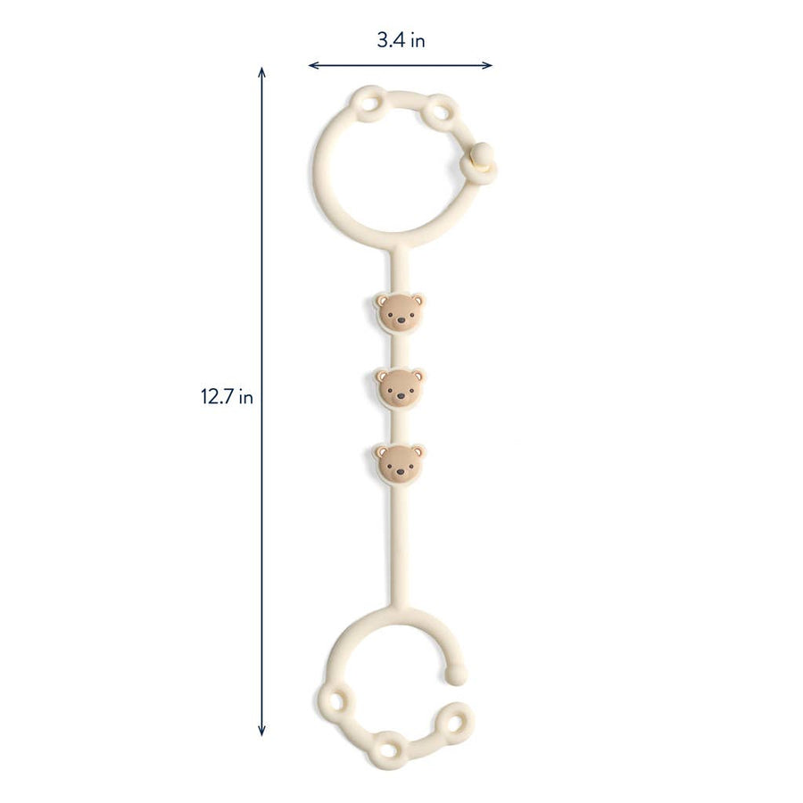 Measurement chart of a white baby cup and toy strap with bear designs on a white background
