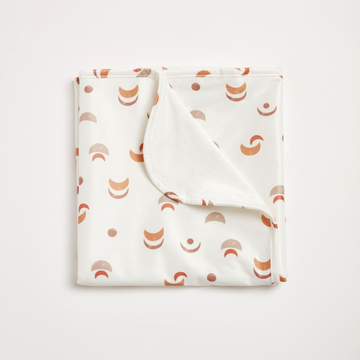 Folded fabric with geometric pattern on a white background