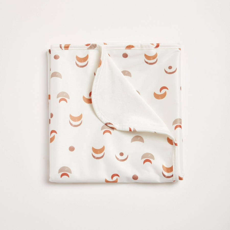 Folded fabric with geometric pattern on a white background