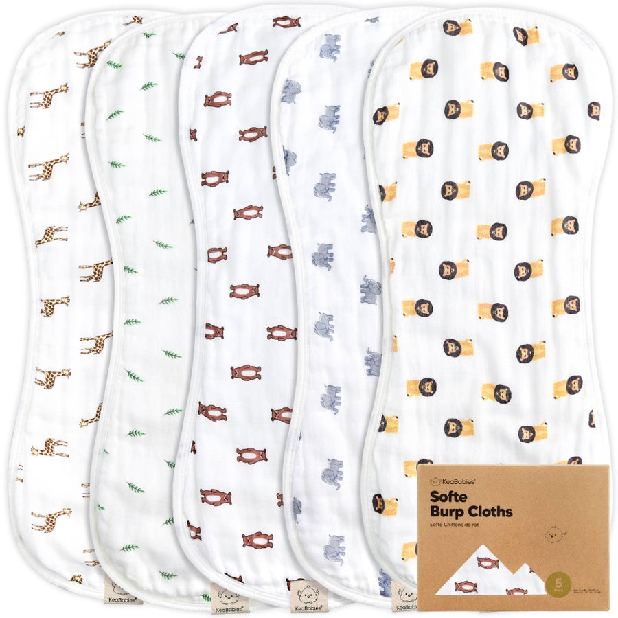 Set of five burp cloths with animal patterns and a cardboard box labeled 'Softee Burp Cloths' on a white background.