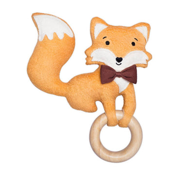 Plush fox toy with a wooden ring on a white background